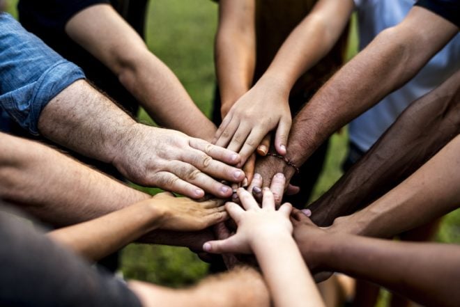 Hands of different skin colors